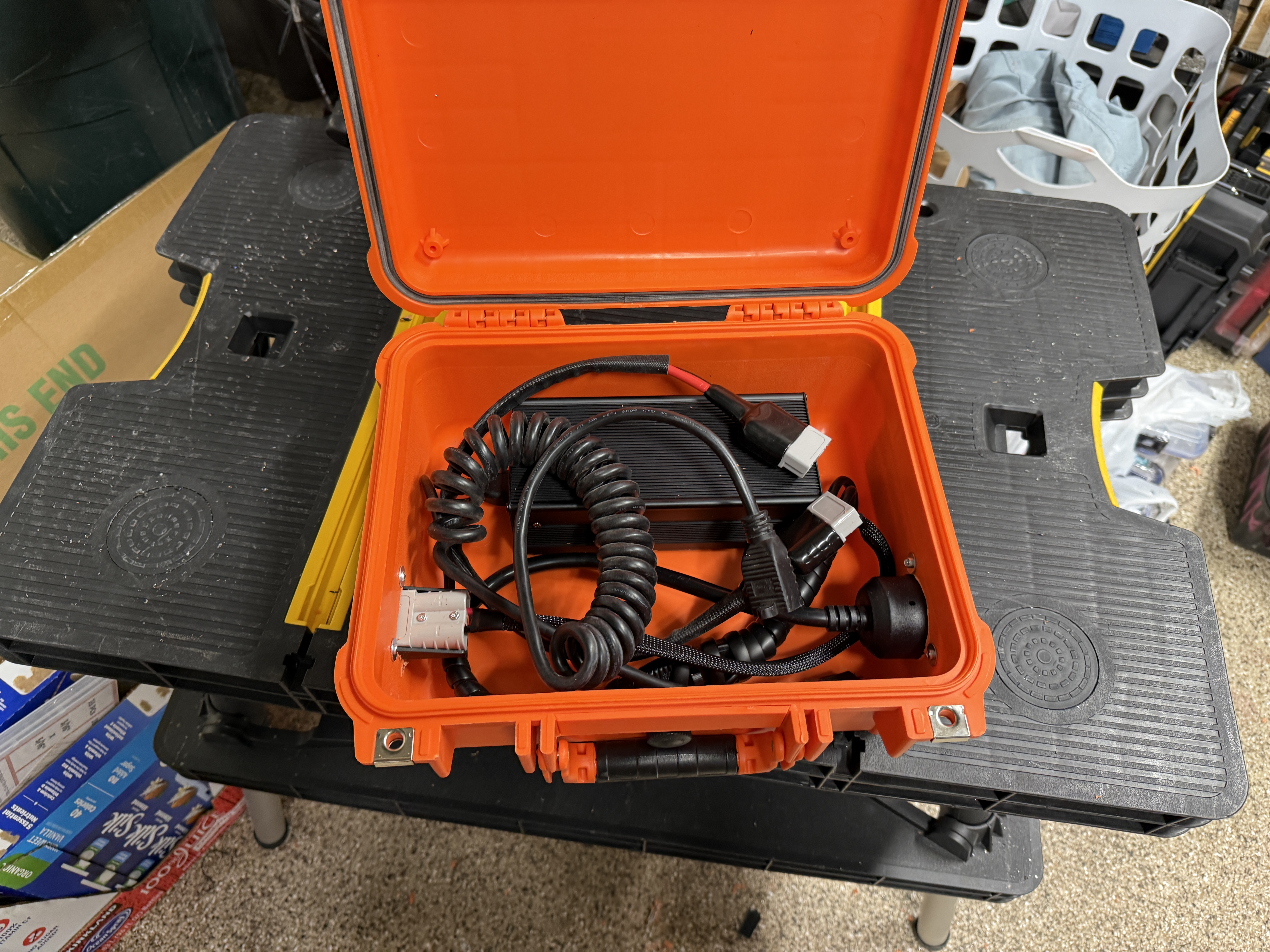 Apache case open with charging cables inside